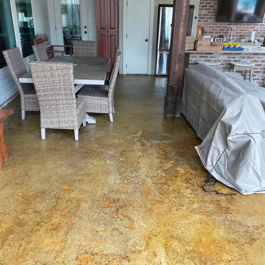 A living room with a table and chairs and a couch