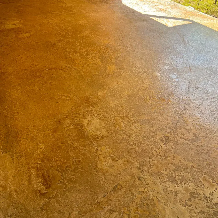 A close up of a concrete floor with a shadow on it.
