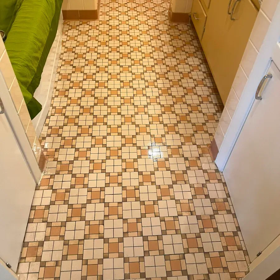 A hallway with a geometric pattern on the floor