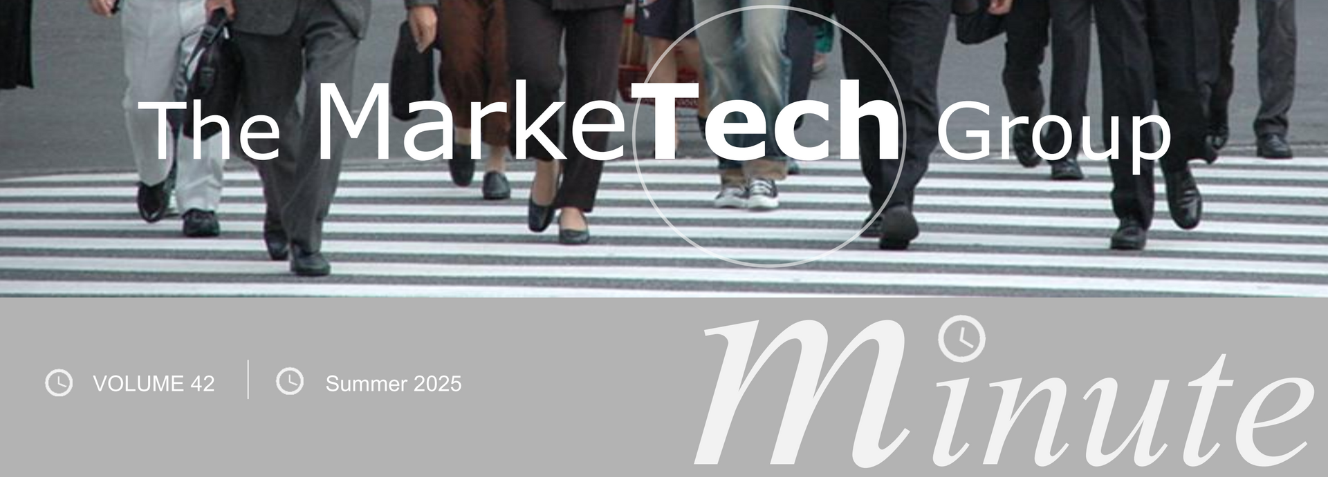 A person is using a calculator in front of a laptop computer.