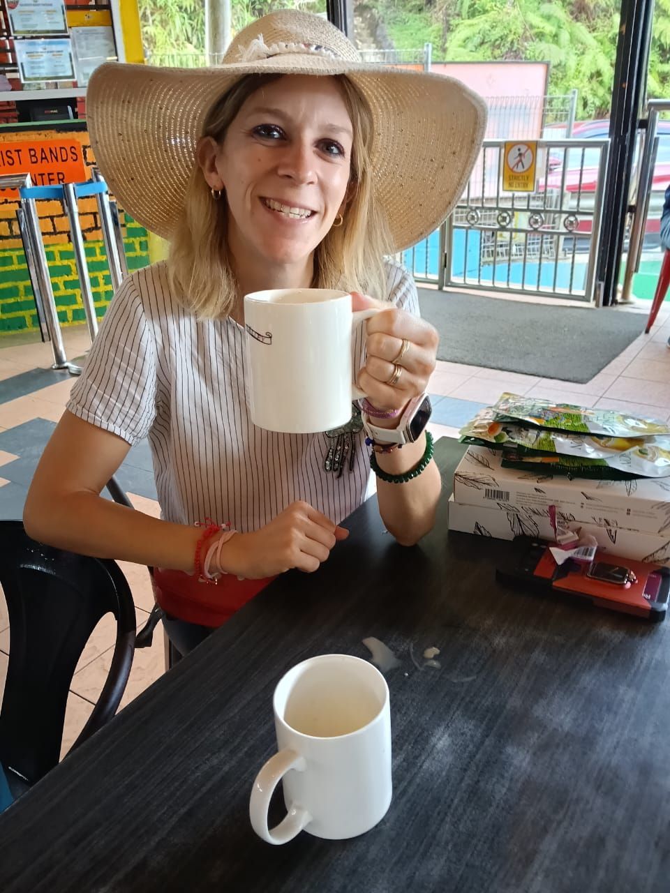 “Happy tourist enjoying Cameron Highlands cafe – RGM Tour & Travel Malaysia”