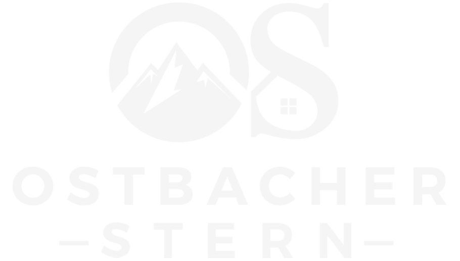 Het logo voor ostbacher achtersteven is een wit logo met een berg in het midden.