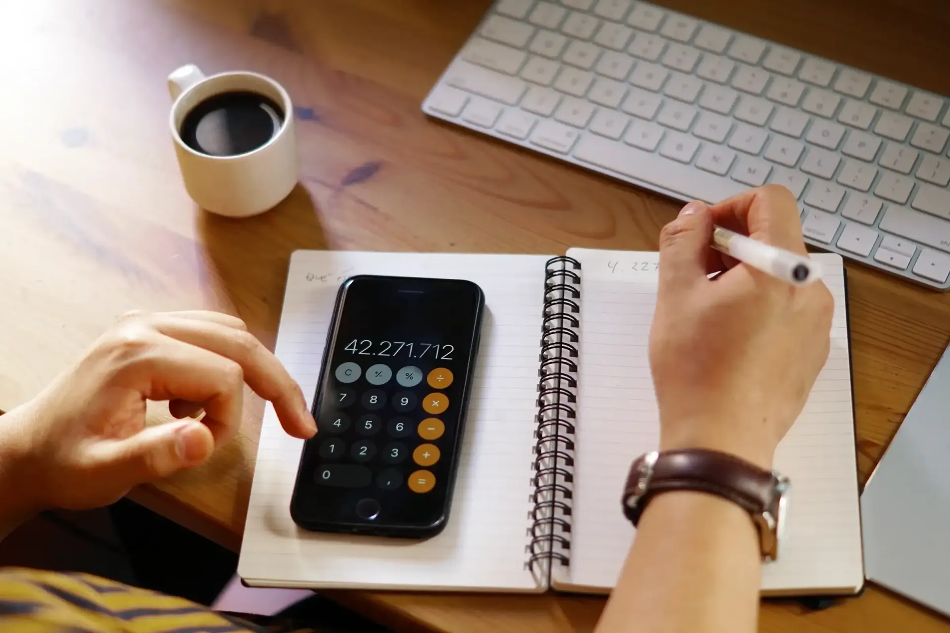 A person calculating their taxes.