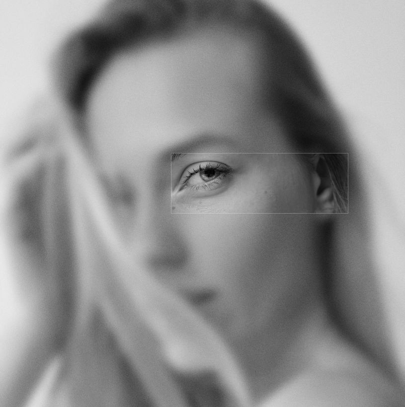 A black and white photo of a woman's face.