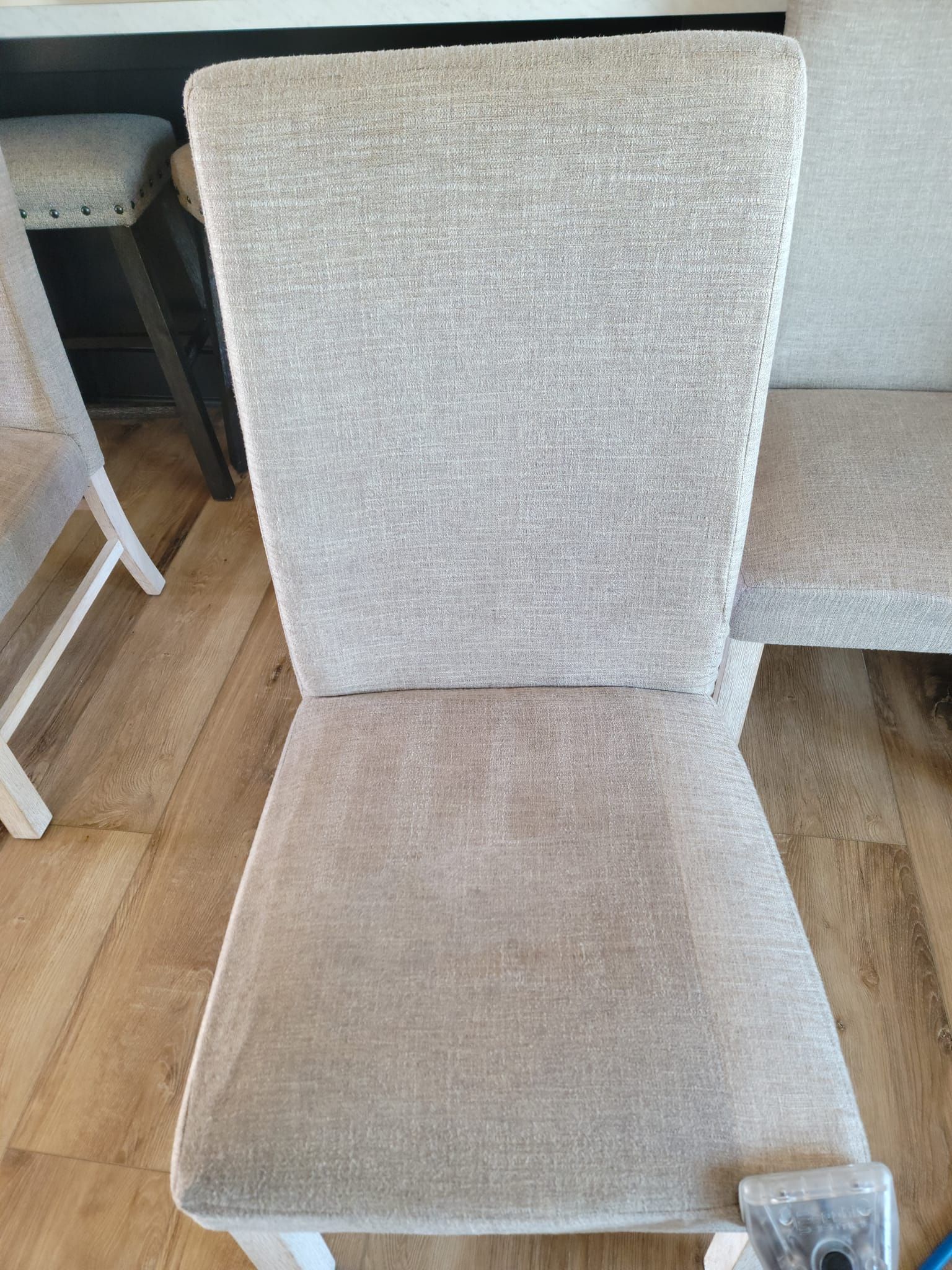 A chair is sitting on a wooden floor in a room.