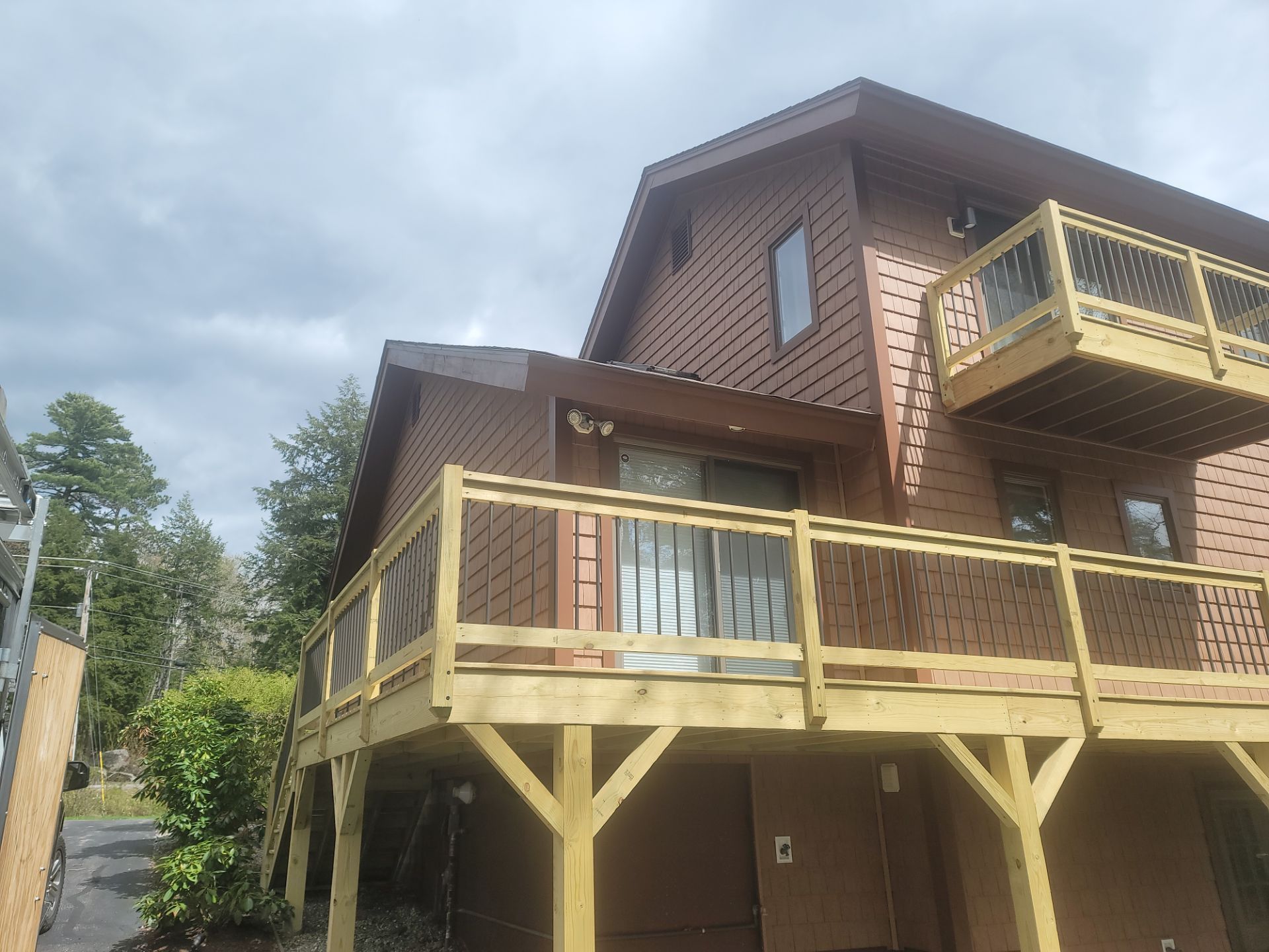 Staining a porch in Manchester, NH.