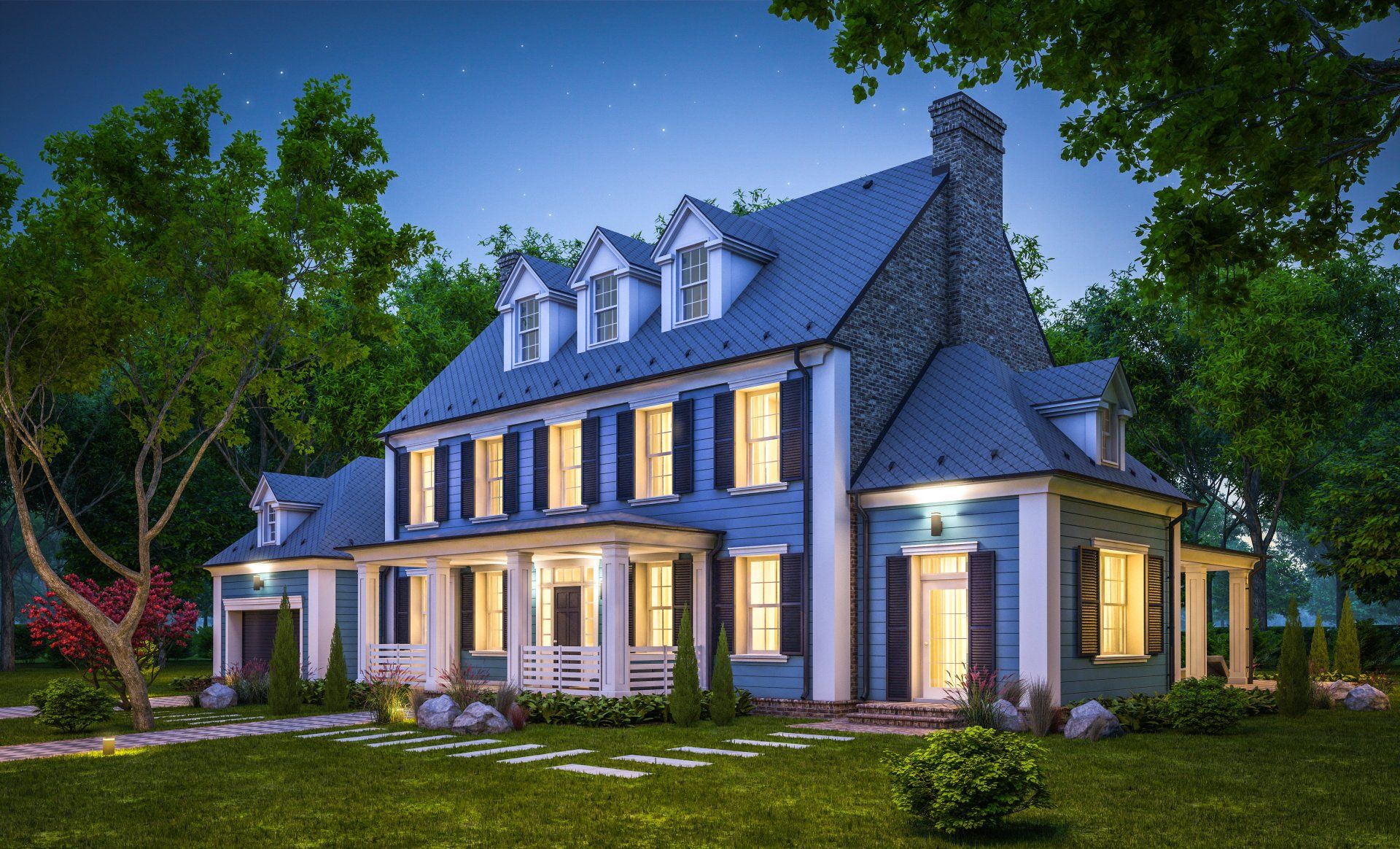 A large house with a lot of windows is lit up at night.