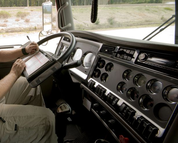 Inside Truck Cab, Person Using a Tablet, Writing — All Auto & Mechanical in The Entrance North, NSW