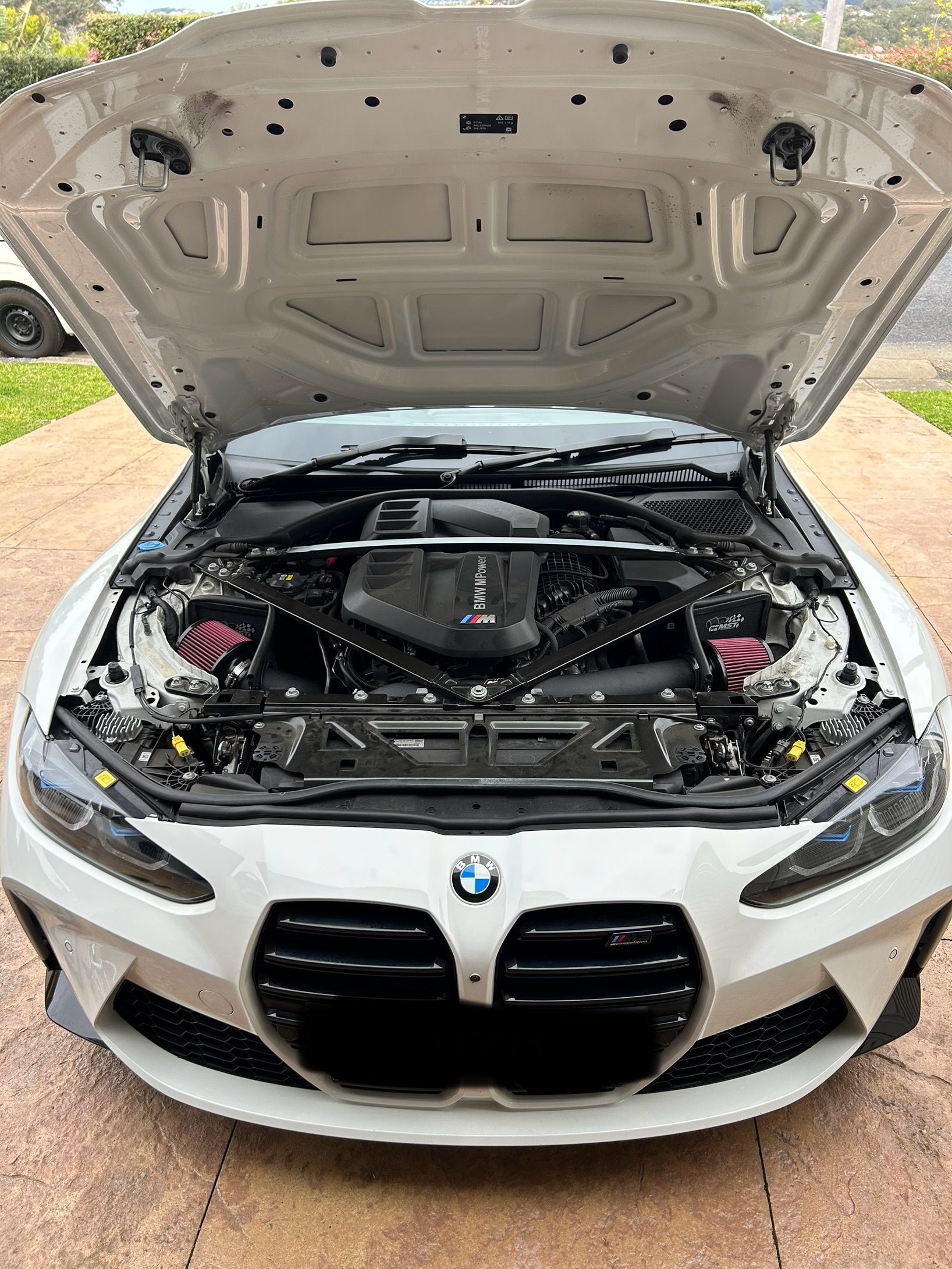 White BMW with hood open, revealing engine bay. Front view, outdoor setting. — All Auto & Mechanical in The Entrance North, NSW