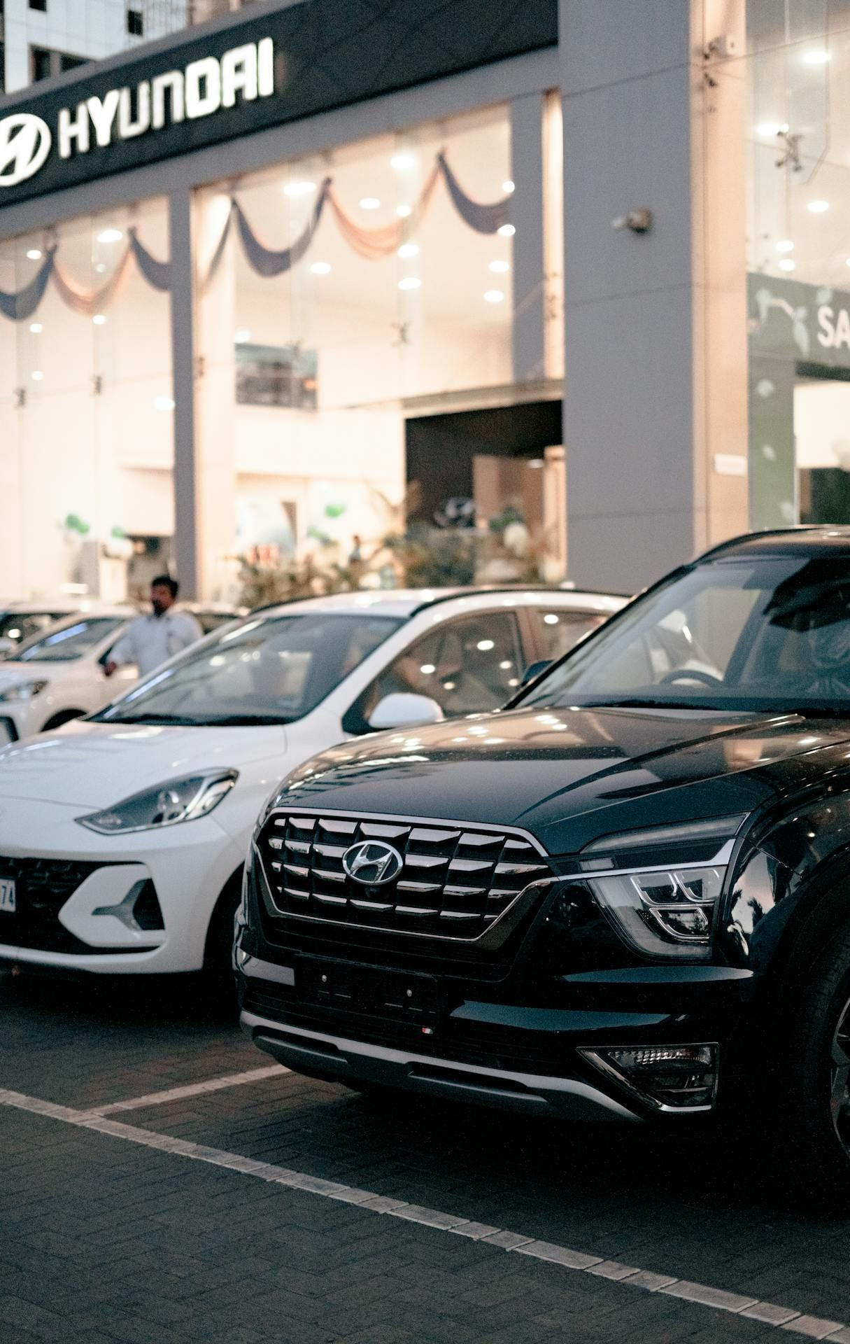 Hyundai dealership with cars parked out front; a black SUV in focus. — All Auto & Mechanical in The Entrance North, NSW