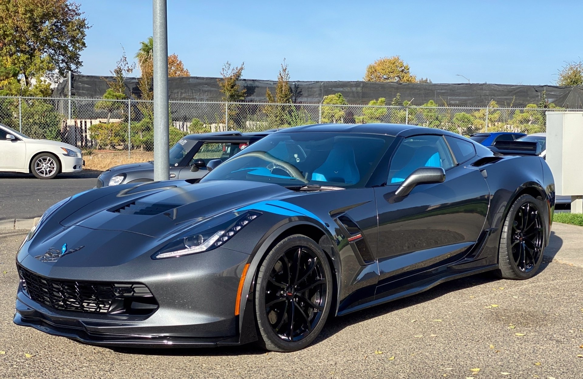 A gray corvette zr1 is parked in a parking lot.