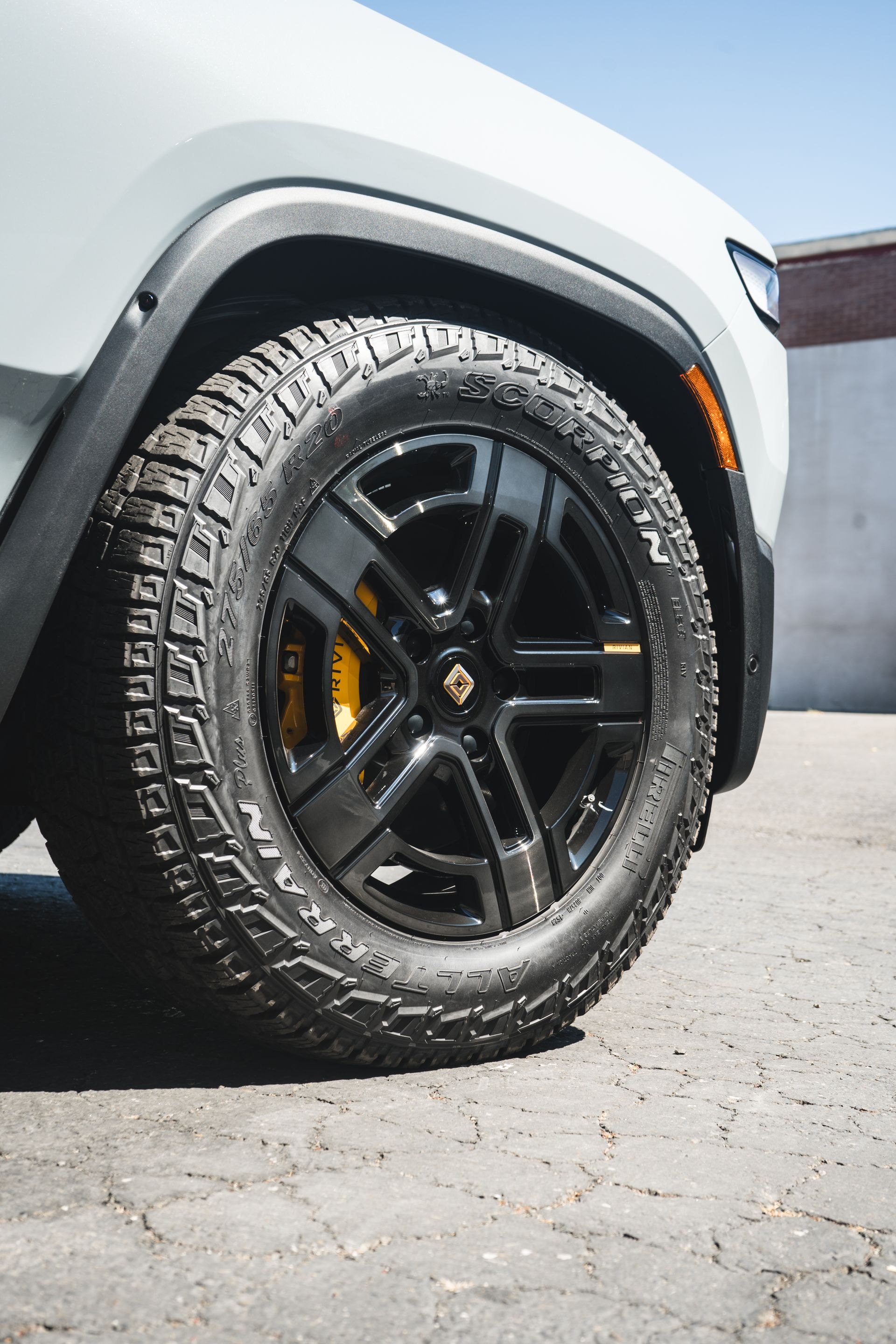 A close up of a tire on a white suv.