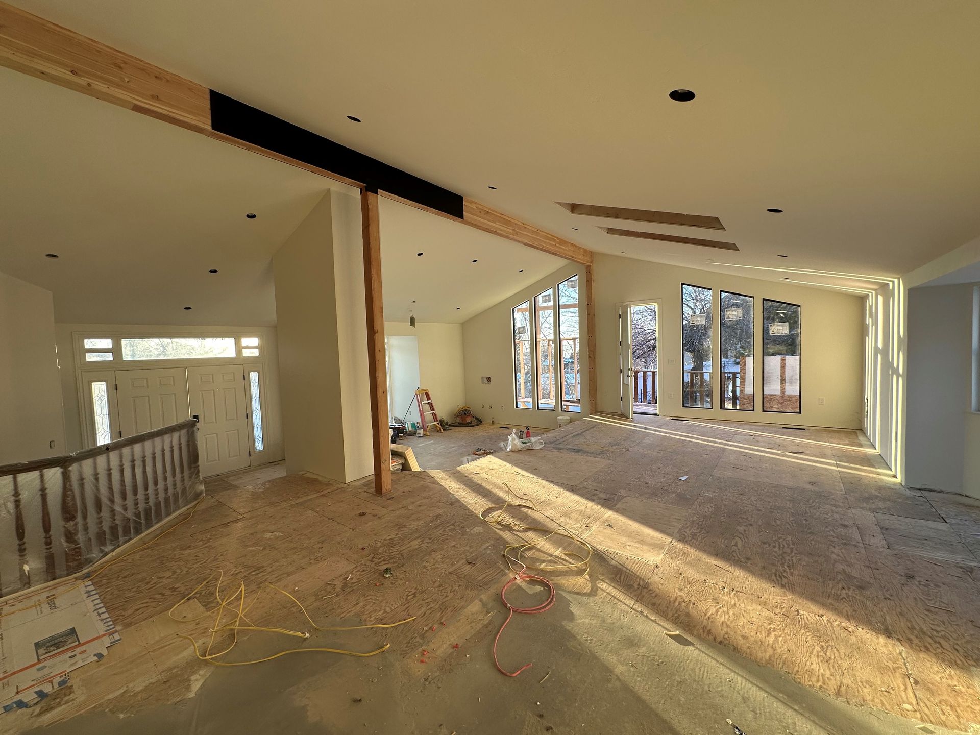 An artist 's impression of a hotel lobby with tables and chairs.