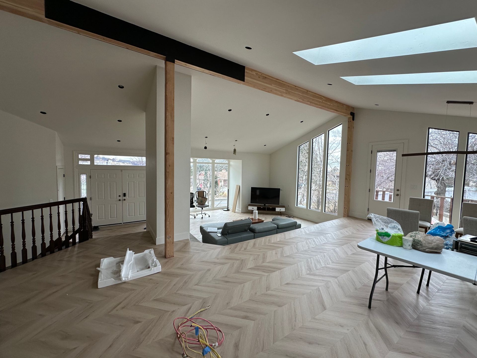 There is a chair and a table in the room.