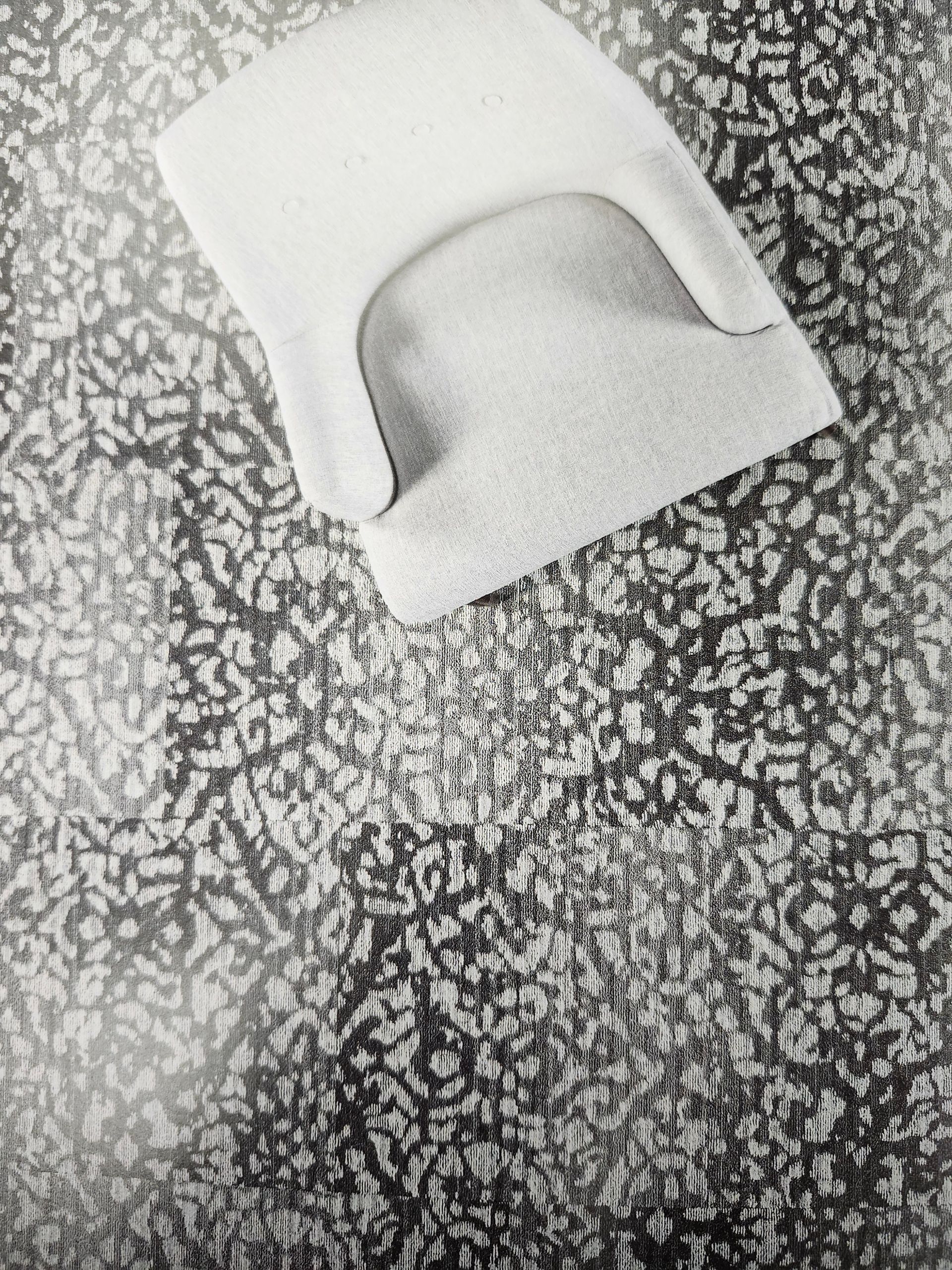 A bunch of blue tiles are wrapped in plastic and sitting on top of a table.