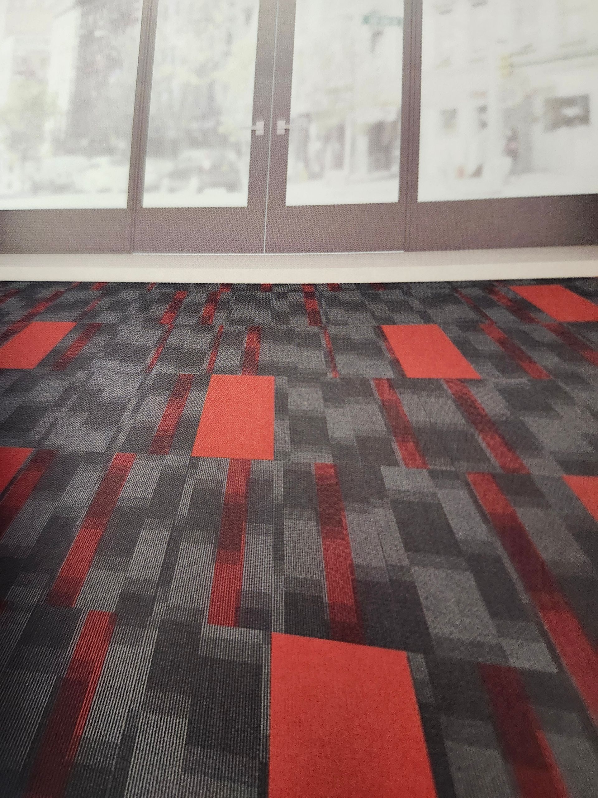 A black and white tile with a geometric pattern on it