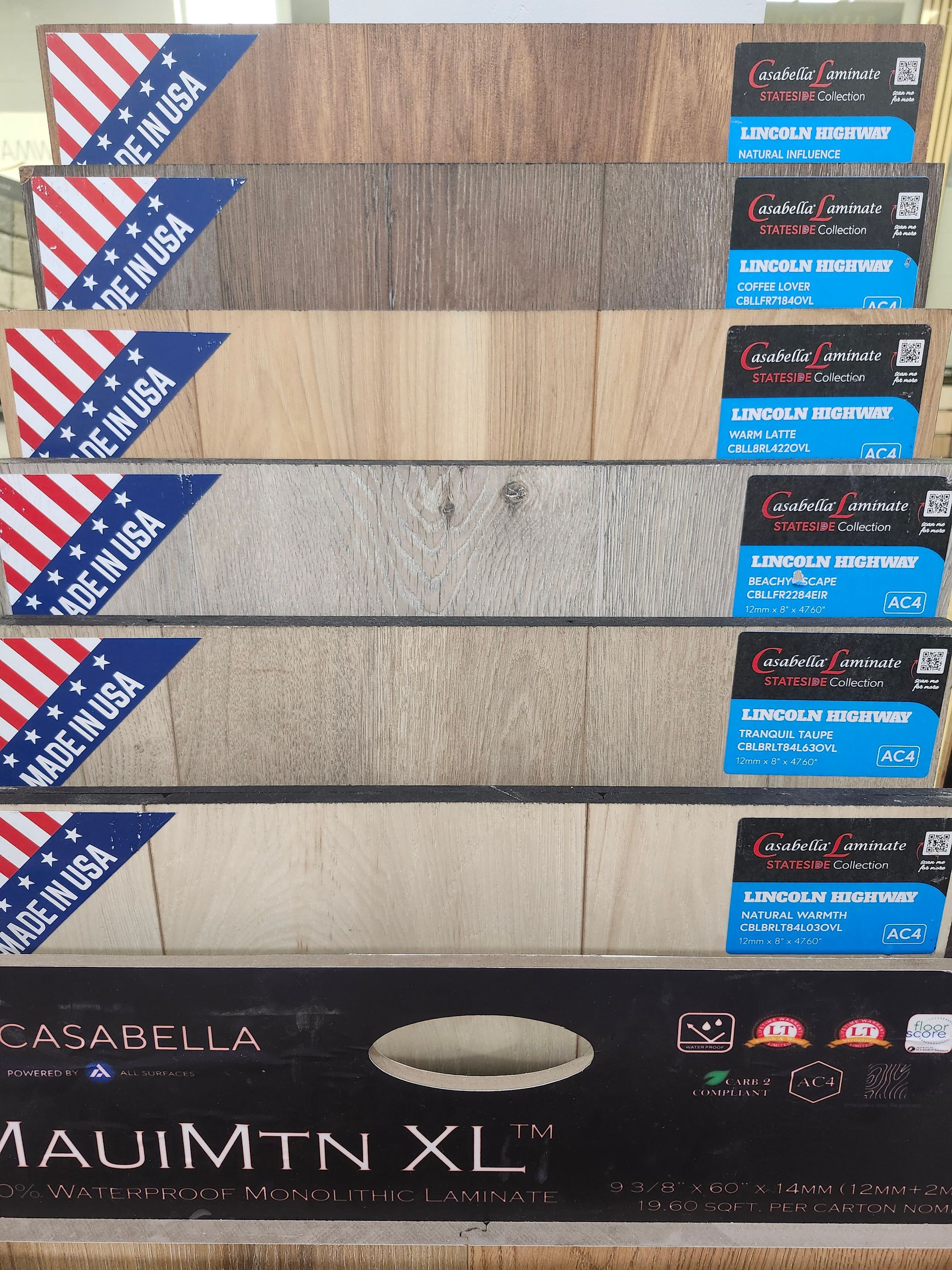 A person is holding a piece of tile in their hand.