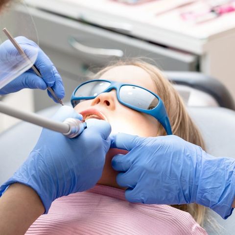 Little Girl Receiving Dental Procedure — Bloomingdale, IL — Dr Boyer & Scheive, DDS