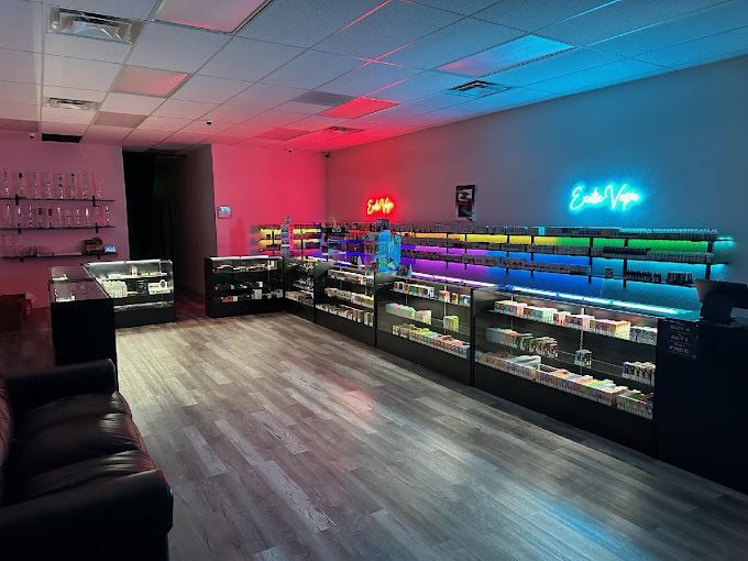 A large room filled with lots of shelves and a couch.