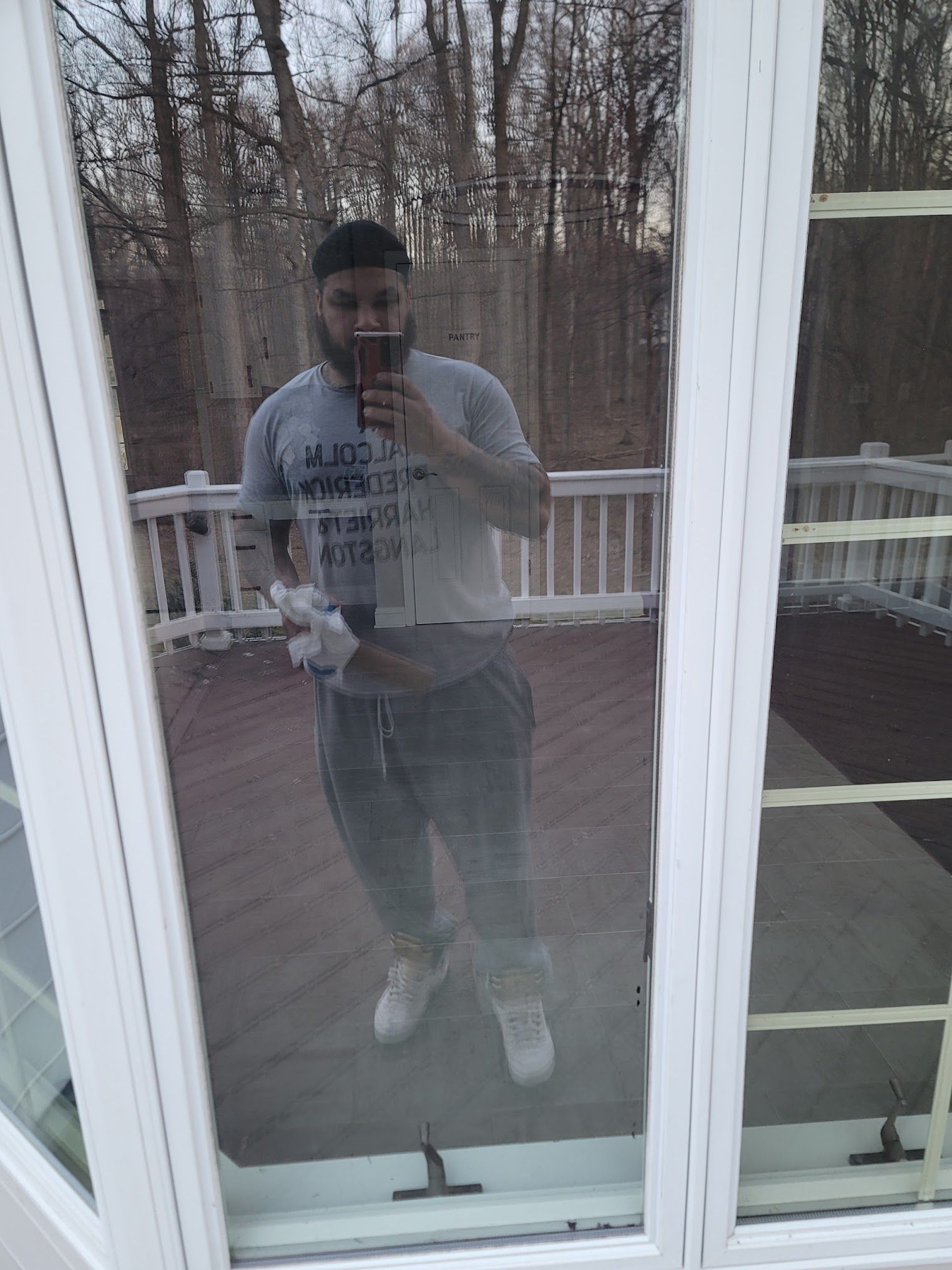 A man is taking a picture of himself in a mirror.