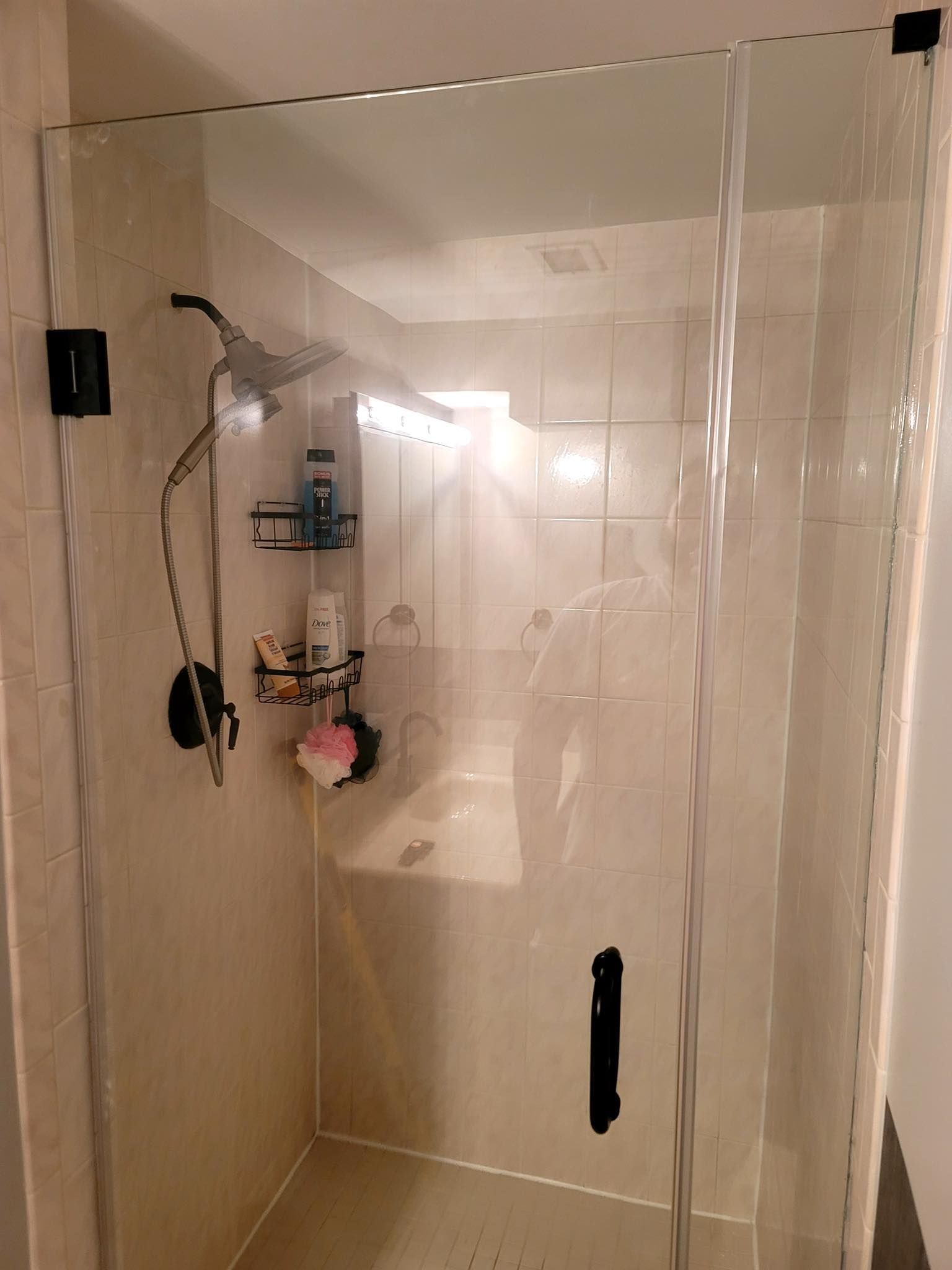 A bathroom with a walk in shower and a bathtub.