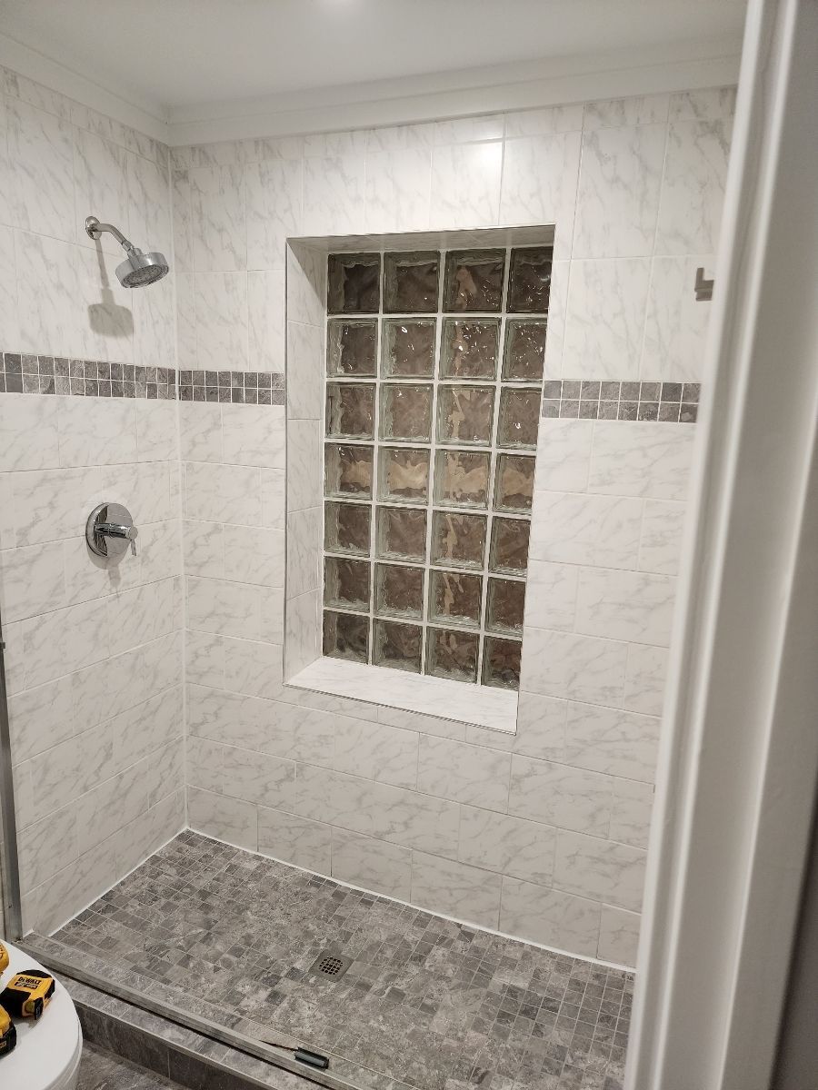 A red barn with a white door and a window