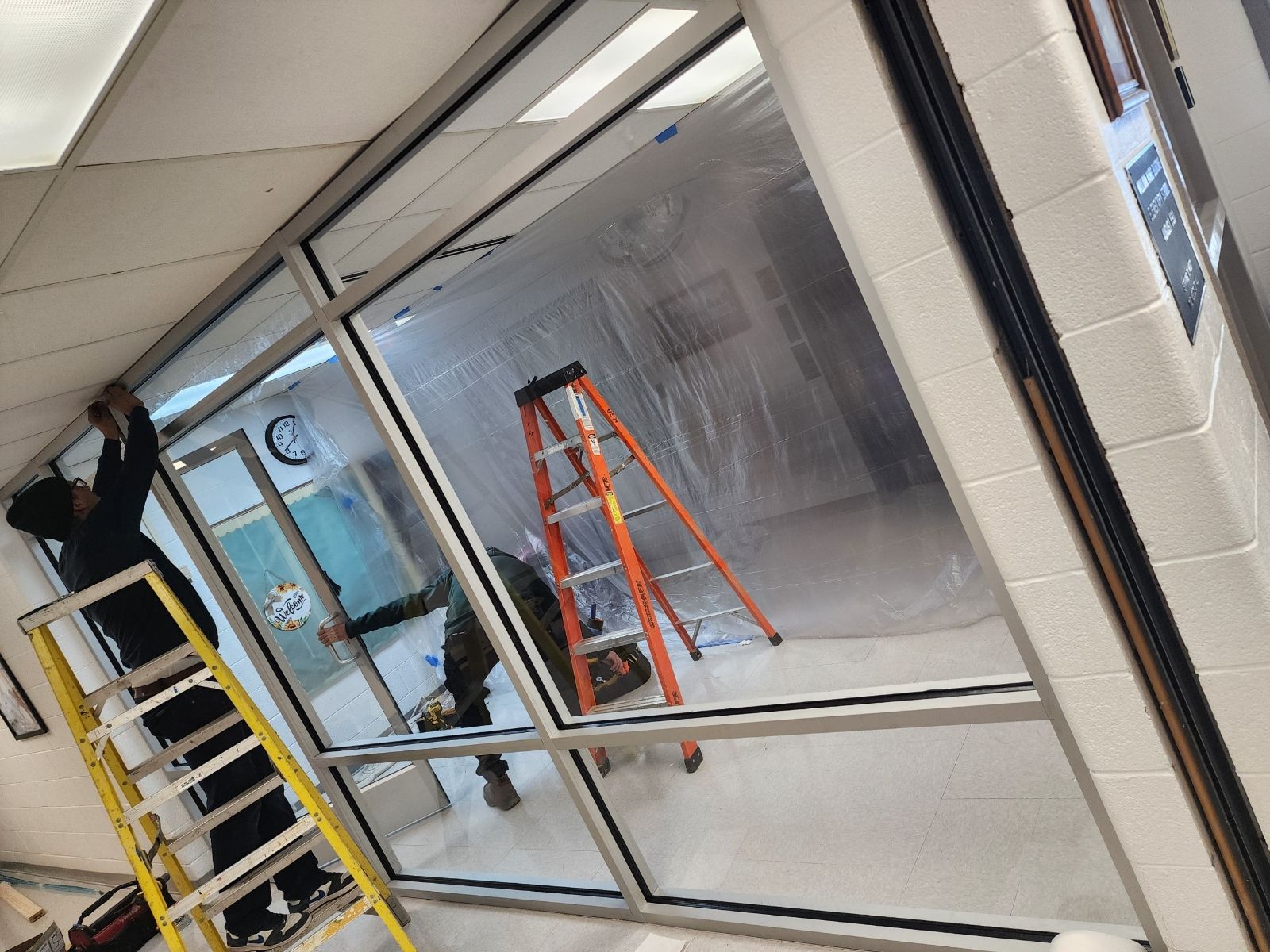 A sliding glass door is being installed in a house.
