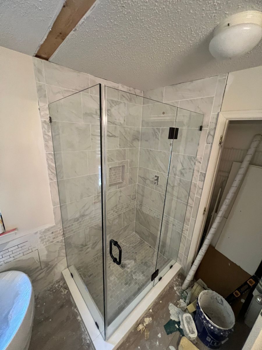 A red and white barn with a white window