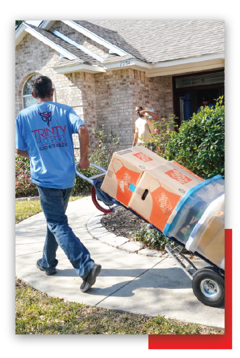Man Blue Shirt Pulling Cart — New Braunfels, TX — Trinity Movers