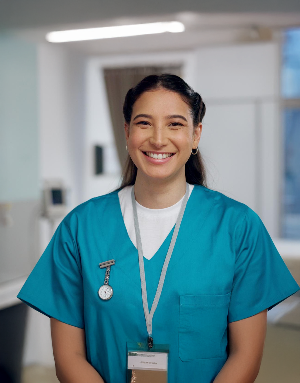 Smiling female caregiver in scrubs at Clearstream Rehab & Nursing Center