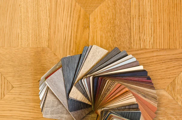 A picture of multiple flooring options from vinyl flooring to wood flooring and even tile flooring 