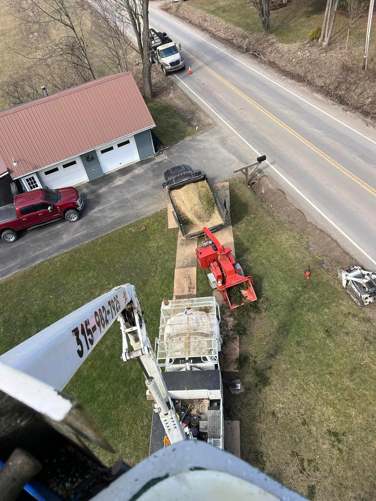 An aerial view of a truck with a crane attached to it.