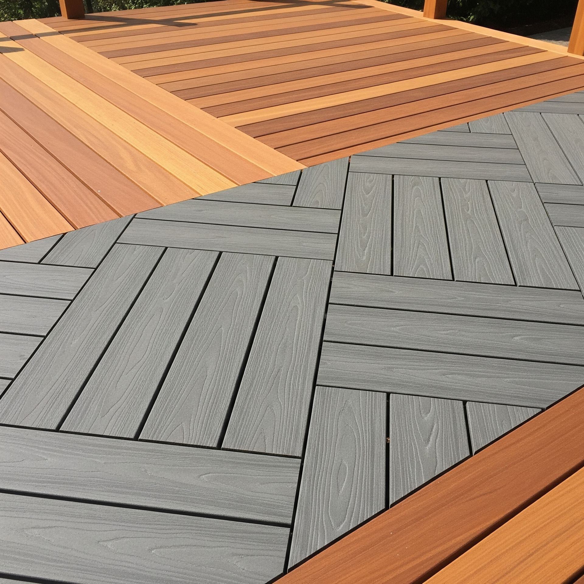A modern deck with sections of warm-toned wood planks and sections of grey composite decking arrange