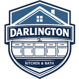 Logo for Darlington Kitchen & Bath featuring a blue and white shield with a house outline and kitchen cabinets.