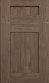 A two-panel shaker-style cabinet door with a matte, warm brown wood grain finish.