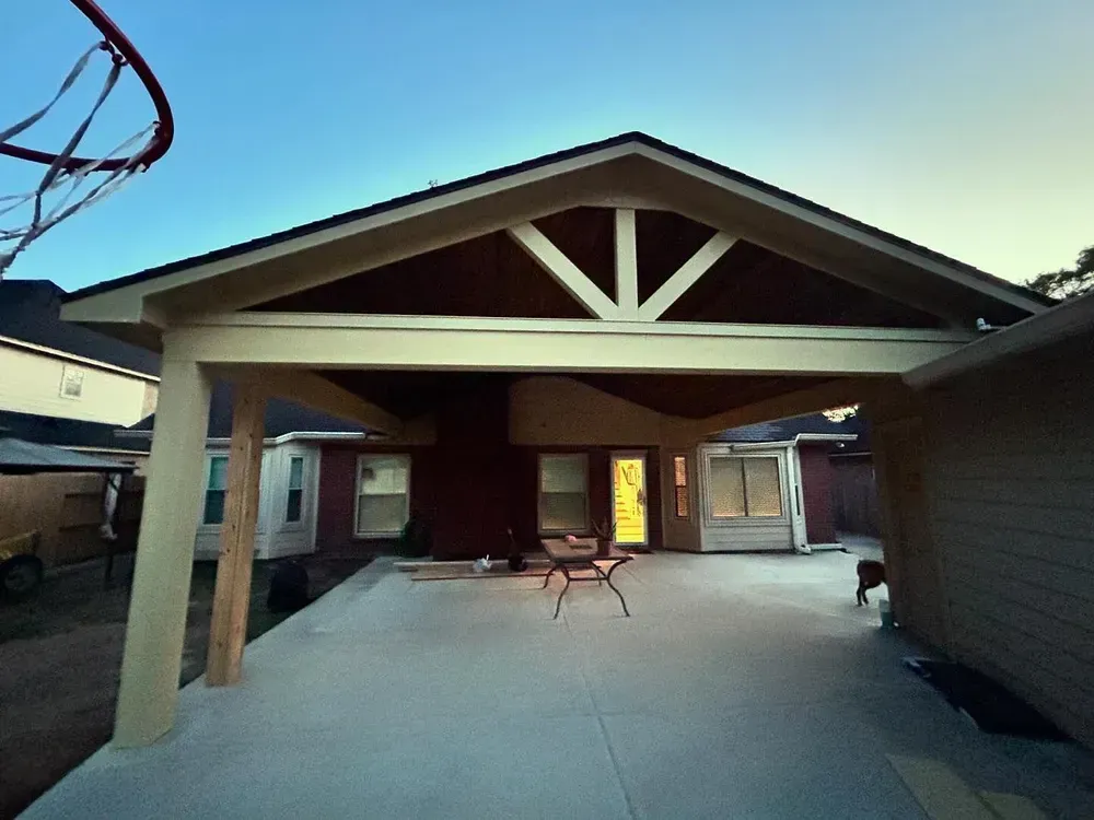 A house with a basketball hoop in the backyard