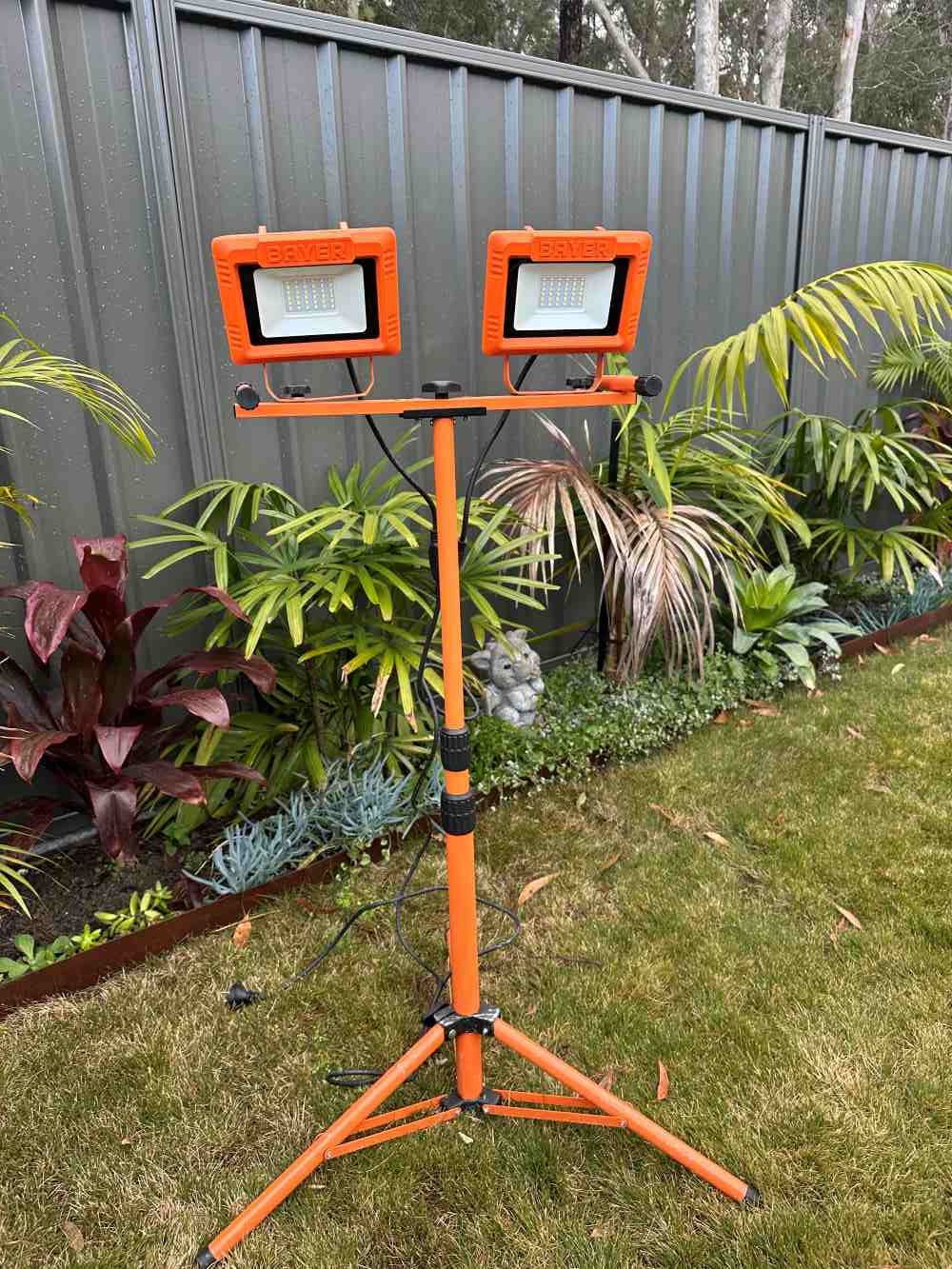 A Flood Lights Sitting on Top of an Orange Tripod — Garrett's Excavation & Equipment Hire in Sanctuary Point, NSW