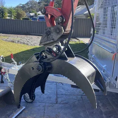 An Large Excavator Claw is Attached to a Trailer — Garrett's Excavation & Equipment Hire in Sanctuary Point, NSW