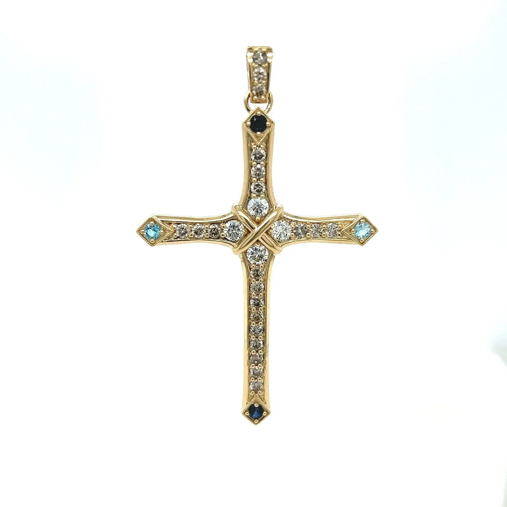A gold cross with diamonds and a black stone
