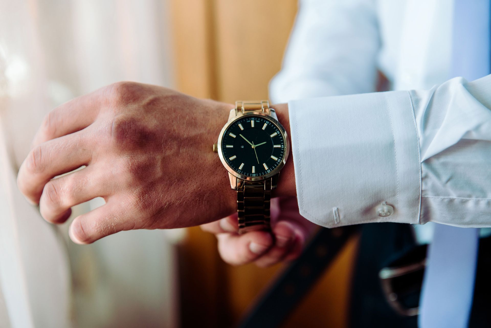 A man is wearing a watch on his wrist.