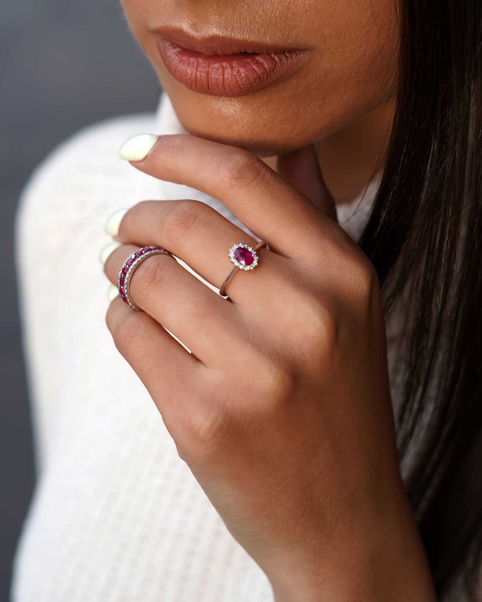 A woman is wearing a ring on her left hand