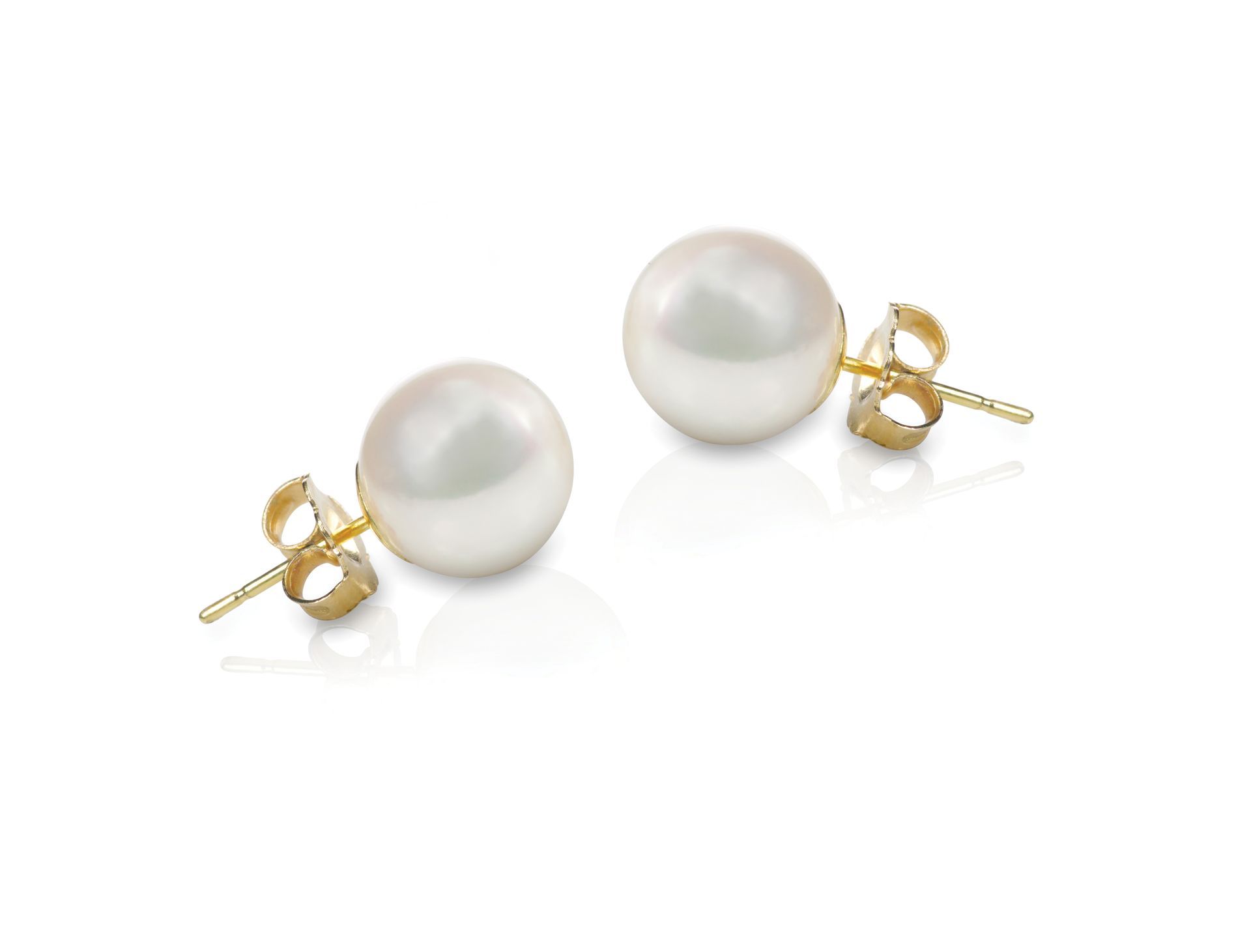 A pair of white pearl stud earrings on a white background.