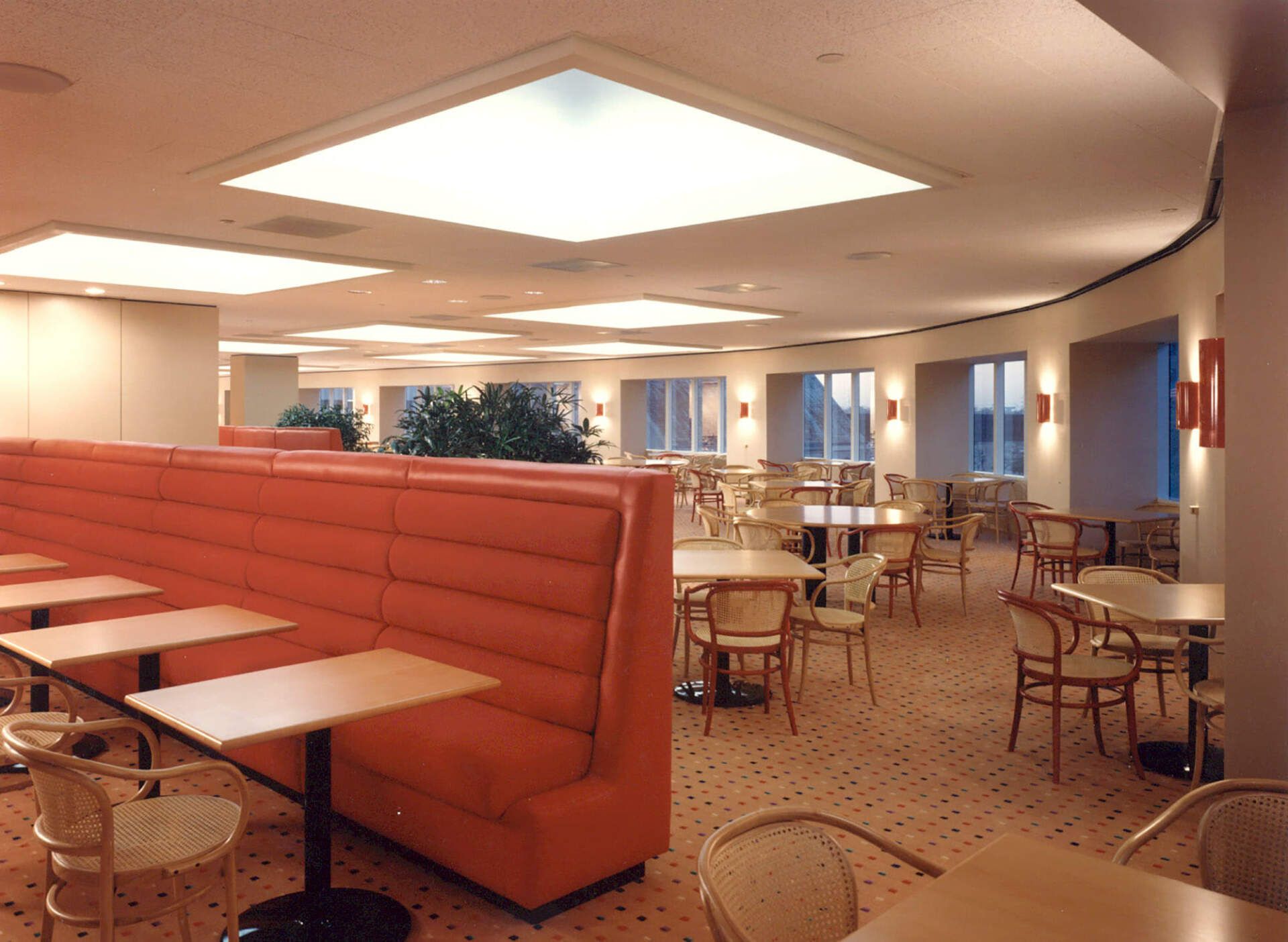 a large room with tables and chairs in it