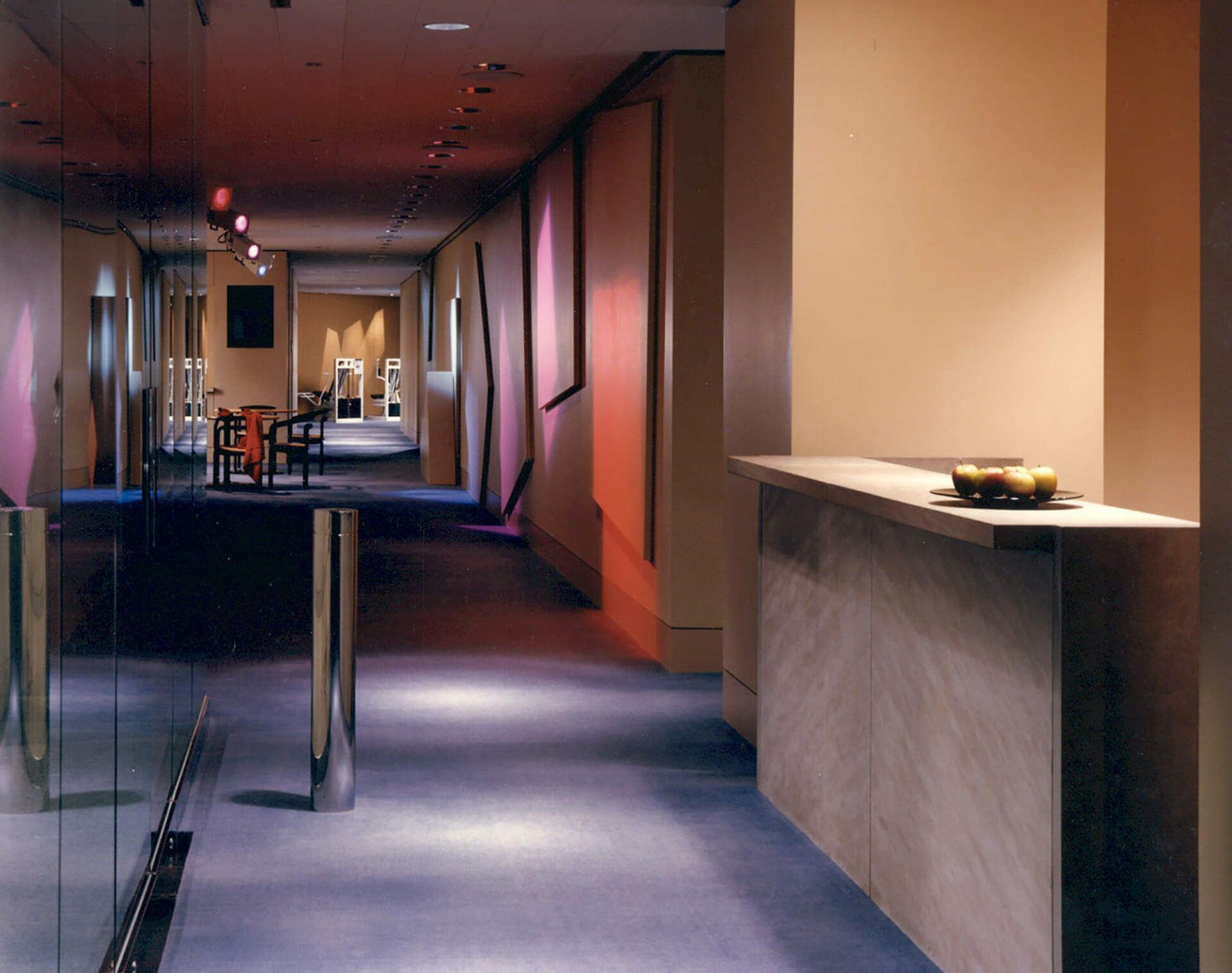 a long hallway with a counter in the middle