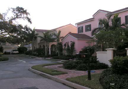a row of houses with a mailbox in the middle