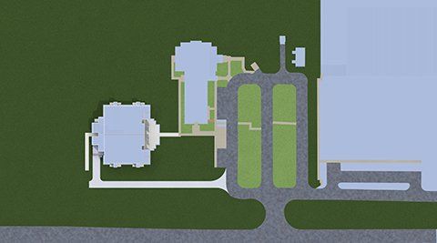 an aerial view of a house with a lot of grass and a driveway .