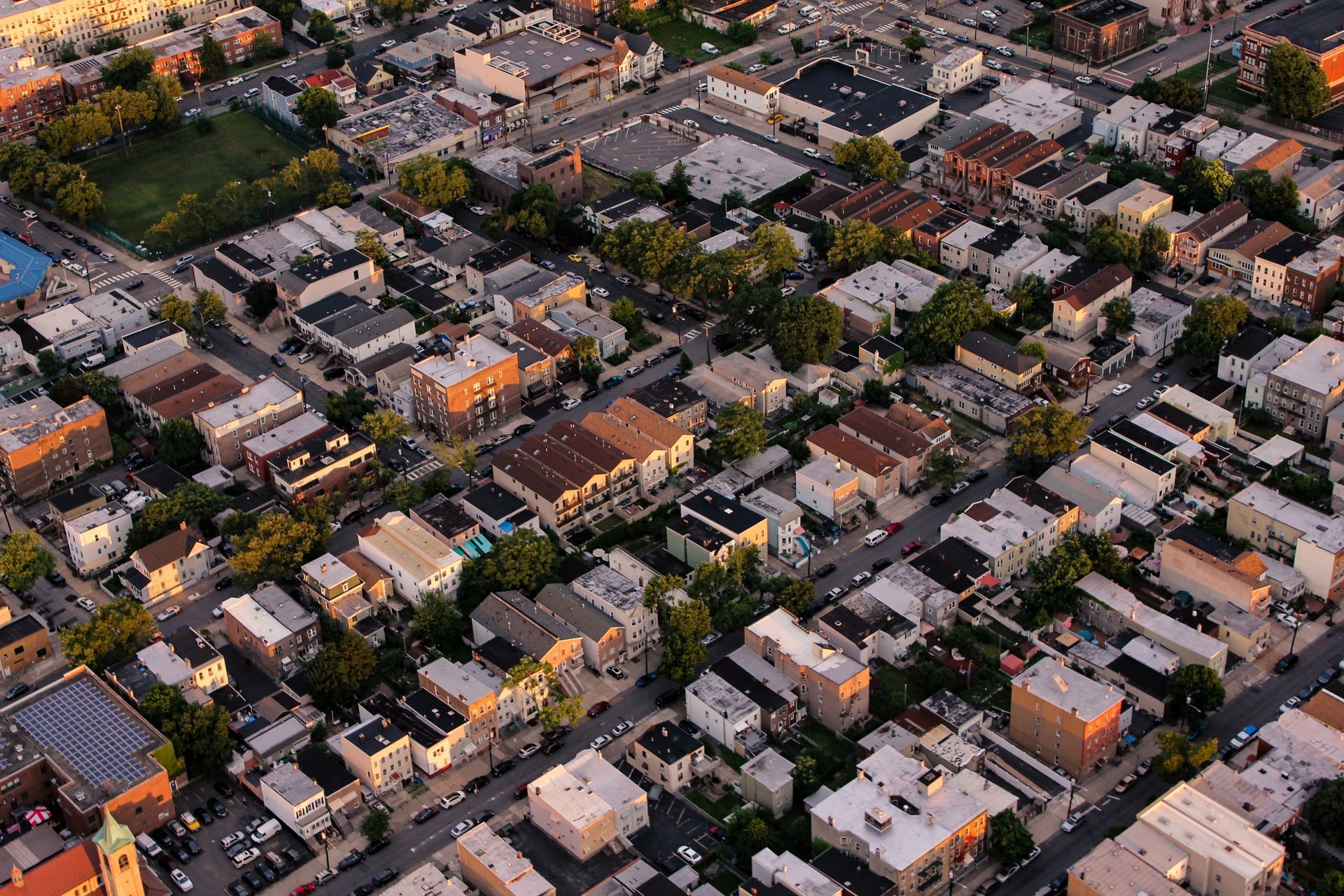 an aerial view of a residential area with lots of buildings and trees .