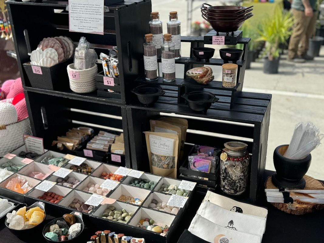 A table with a variety of items on it including bottles and bowls.