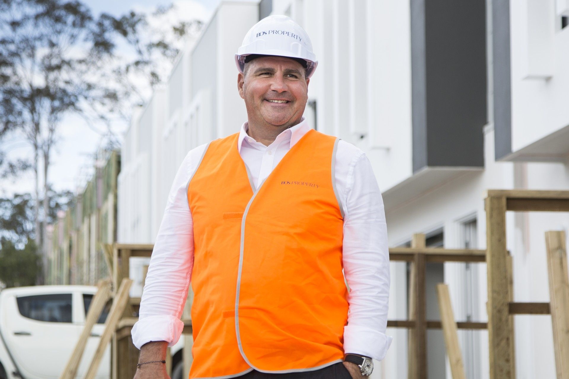 Gold Coast property developer Romolo Bos smiling onsite at The Mill Residences, Pimpama.