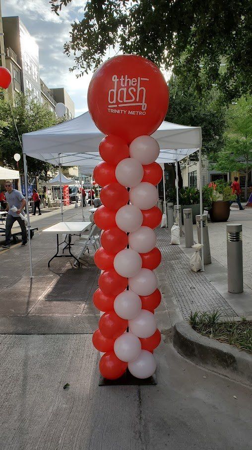 A red and white balloon with the word dash on it